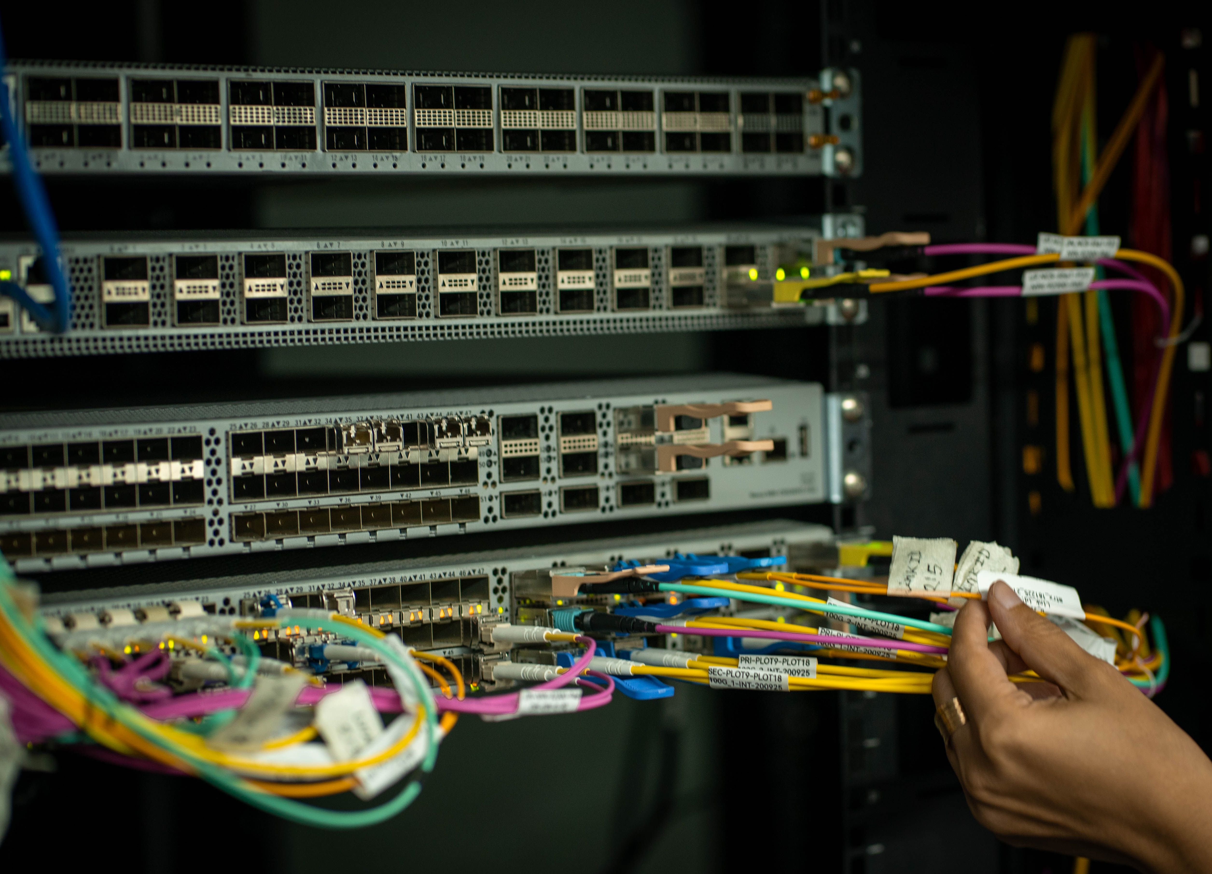 Fiber cross-connects and network equipment in a colocation rack